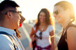 © dusanpetkovic1 - Group of charming friends with sunglasses and backpacks.
