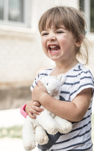 Little Girl With Toy Lamb