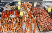 Various Seafood On The Shelves Of The Fish Market In Bergen In Norway