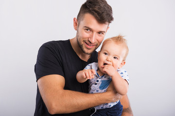 handsome young father with little boy .