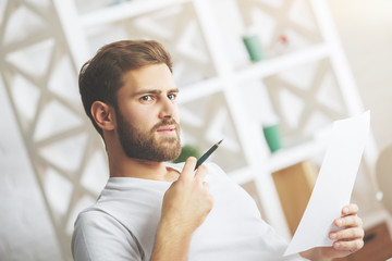 Canvas Print - Caucasian man examining document side