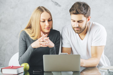 Wall Mural - European man and woman using device