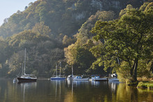 Boats And Autumnal Colour. Ullswater, Cumbria, UK.