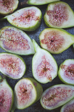 Homegrown Organic Figs Cut In Half On Tray Sprinkled With Sugar Ready To Bake