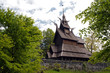 Fantoft Stavkirke - wooden church near Bergen, Norway, surrounded by trees, viking architecture