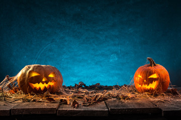 Halloween pumpkins on wooden planks.