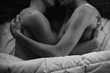© Daring Wanderer/Stocksy - Young gay couple hugging in bed shirtless