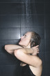 © Danil Nevsky/Stocksy - Young woman taking shower