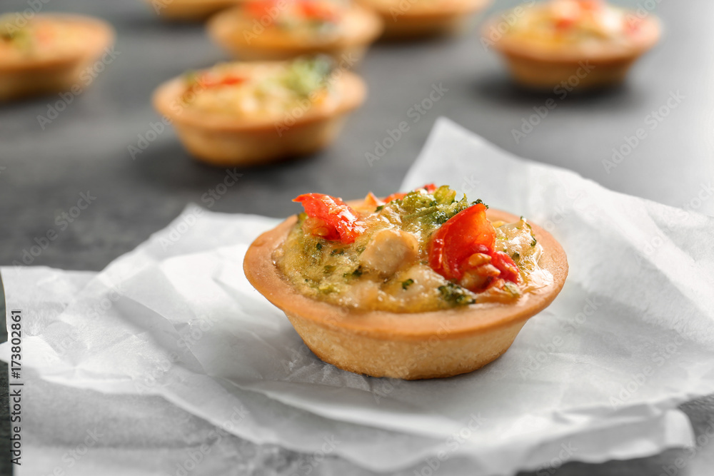 Broccoli quiche tartlet on table