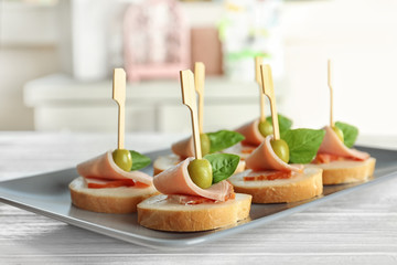 Delicious canapes for baby shower on plate