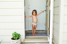 Little Girl Stand In Doorway In Underwear