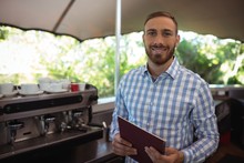 Smiling Manager Holding Clipboard