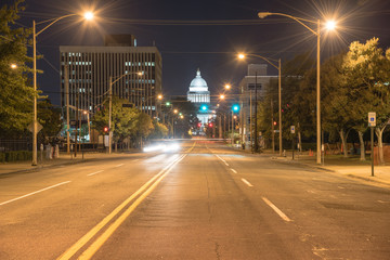 Street light and tree line leading to State Capitol of Arkansas, a scale replica of the US capitol located in Little Rock. The main house of Arkansas government, famous landmark and tourist attraction