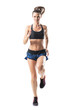 © sharplaninac - Front view of young pretty female athlete sprinting towards camera. Full body length portrait isolated on white studio background.