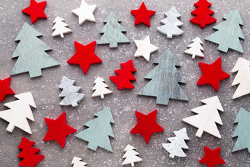 Christmas wooden decor on the snow background.