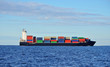 © Aastels - Black container ship sailing in calm water near port of Riga