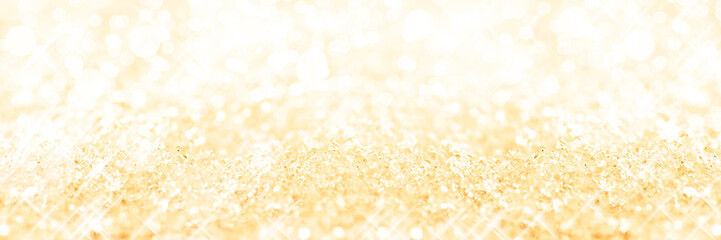 Wall Mural - Panoramic golden background of snow, holiday glittering background