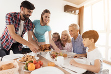 Family To Sit Down For A Festive Dinner For Thanksgiving
