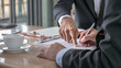 © Mongkolchon - The selective and soft focused image of businessman is going to sign the contract in the business meeting.