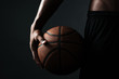 © Drobot Dean - Cropped photo of basketball player holding ball