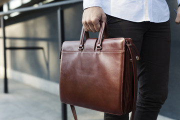 holding briefcase