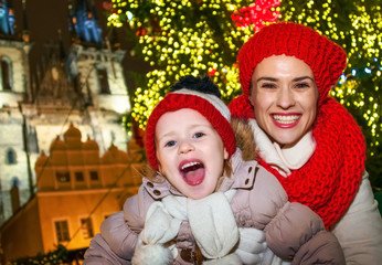 mother and daughter tourists at Christmas in Prague Czechia