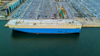 Canvas Print - Aerial view rows of new cars waiting to be dispatch and shipped, New cars lined up in the port for import export around the world.