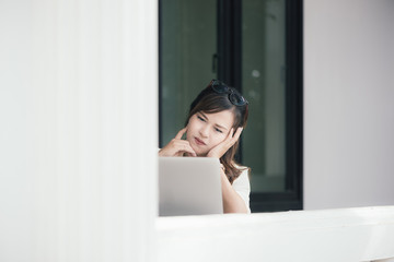 Wall Mural - Asian girl business thinking idea for a new project, freelance thinking idea for a new project in selective focus.