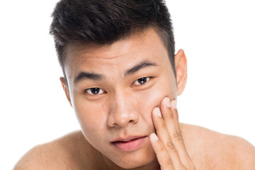 Handsome man worry about his wrinkles close up portrait studio on white background