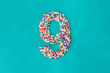 © Kathryn Swayze/Stocksy - The number nine built from nonpareils