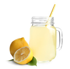 Mason jar with fresh lemon juice on white background