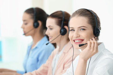 Canvas Print - Young female technical support dispatchers working in office