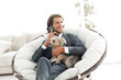© ASDF - successful businessman holds his dog and pet and talks on the smartphone
