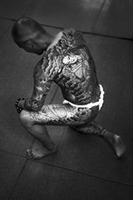 Black And White Portrait Of A Japanese Man Heavily Tattooed With Traditional Japanese Motifs