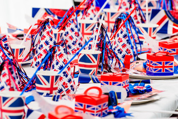 long tables with red, white and blue party accessories at a royal event street party