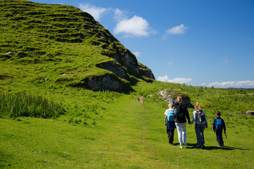 beautiful green fields and hills of ireland, hiking family with children