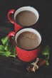 Delicious cocoa wih mint on wooden table 