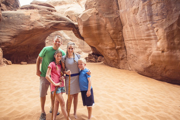 Wall Mural - Family hiking and sightseeing together at Arches National Park 