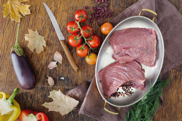 Poster - Fresh beef tenderloin in frying pan with vegetables