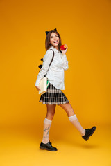 Poster - Full length portrait of a happy schoolgirl in uniform