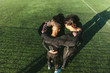 Soccer team standing in a huddle
