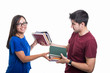 © Catalin Pop - Handsome student couple exchanging bunch of books
