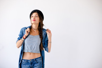 Wall Mural - Portrait of smiling showing teeth young woman with hat