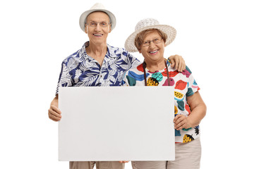 Poster - Elderly tourists holding a blank signboard