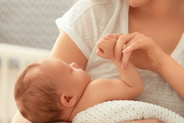 Canvas Print - Mother holding sleeping newborn baby, closeup