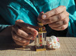 A woman opens the perfume oil. Scented oil in women's wrists. Arabian perfume oil.

