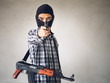 Portrait terrorist man holding gun, carbine and machine gun