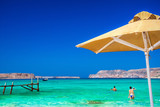 Fototapeta Most - Amazing panorama of Balos Lagoon with magical turquoise waters, lagoons, tropical beaches of pure white sand and Gramvousa island on Crete, Greece