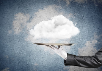 Wall Mural - Hand of waitress presenting cloud on tray.