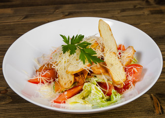 Sticker - Caesar salad with croutons, cheese, eggs, tomatoes and grilled chicken on wooden tabel. 